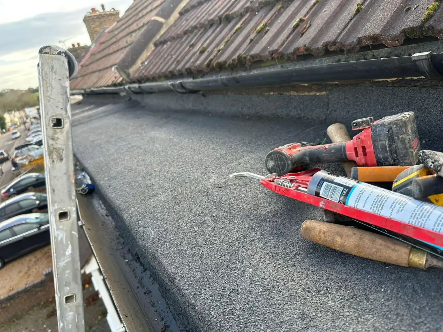 flat-roof-repair-tools-on-roof-london-summit-services-london-ltd
