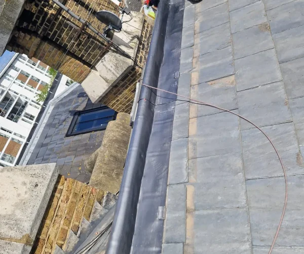 roofer-installing-lead-valley-gutter-london-summit